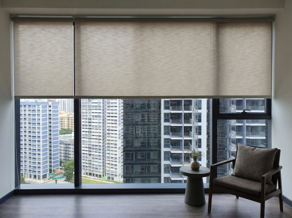 Dimout roller blind on office workspace windows in Clarke Quay Singapore, soft filtered daylight reducing screen glare for a productive and comfortable working environment