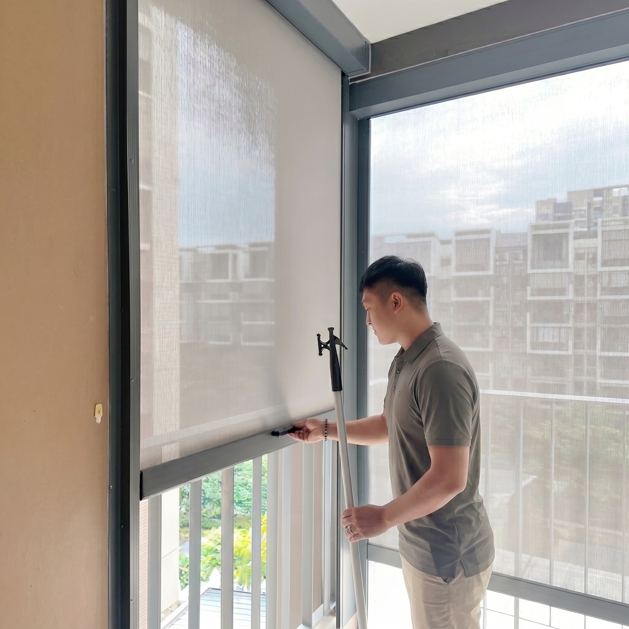 Manual zip blind operated with a pull stick at The Tapestry condo in Singapore.