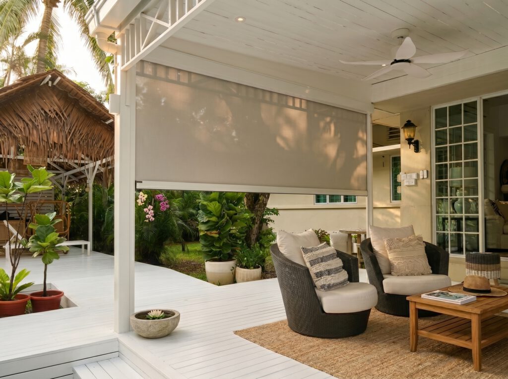 Outdoor zip screen protecting an East Coast landed patio from heat and glare.