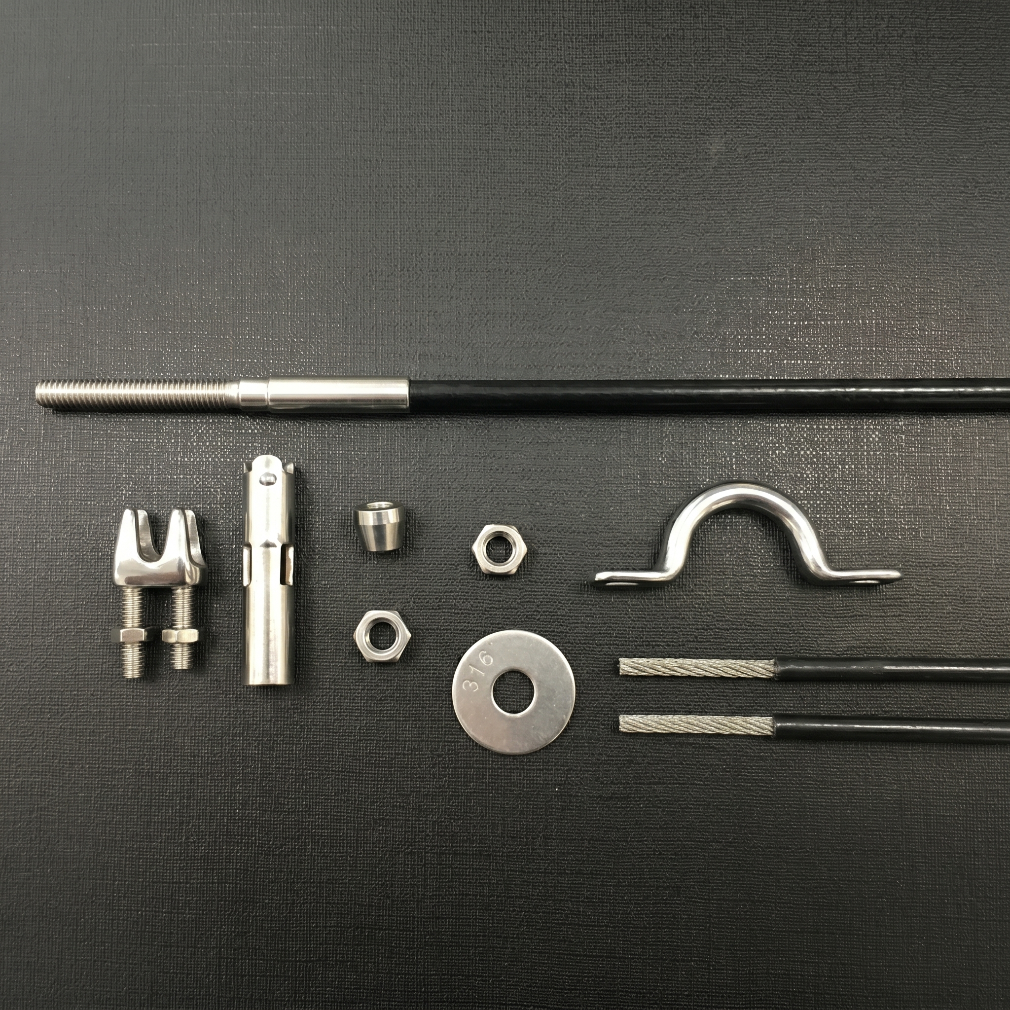 Stainless steel cable side guide components used for outdoor blinds installations in Singapore.