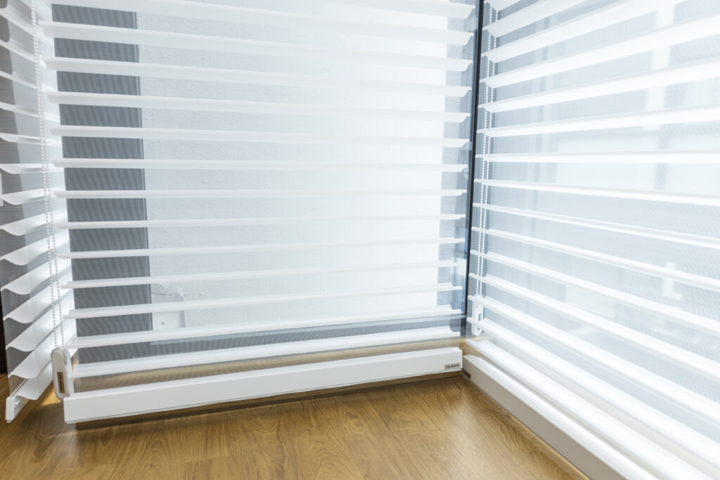 Close-up of Trishade blinds showing 3 layer fabric vanes for soft light control in Singapore homes.