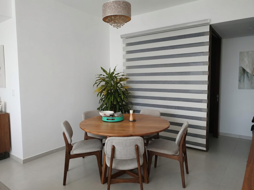 Zebra blinds Singapore installation in a Punggol HDB dining area with modern double layer fabric design.