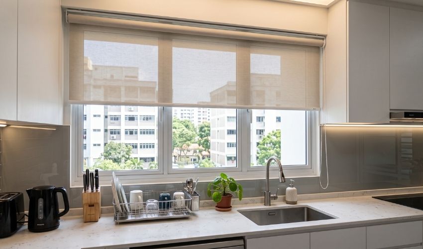 Roller blinds fitted in a Bedok kitchen for easy cleaning and moisture resistance