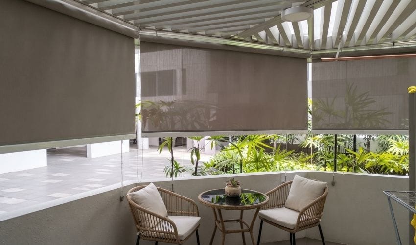 Outdoor blinds shading an exposed HDB balcony in Singapore