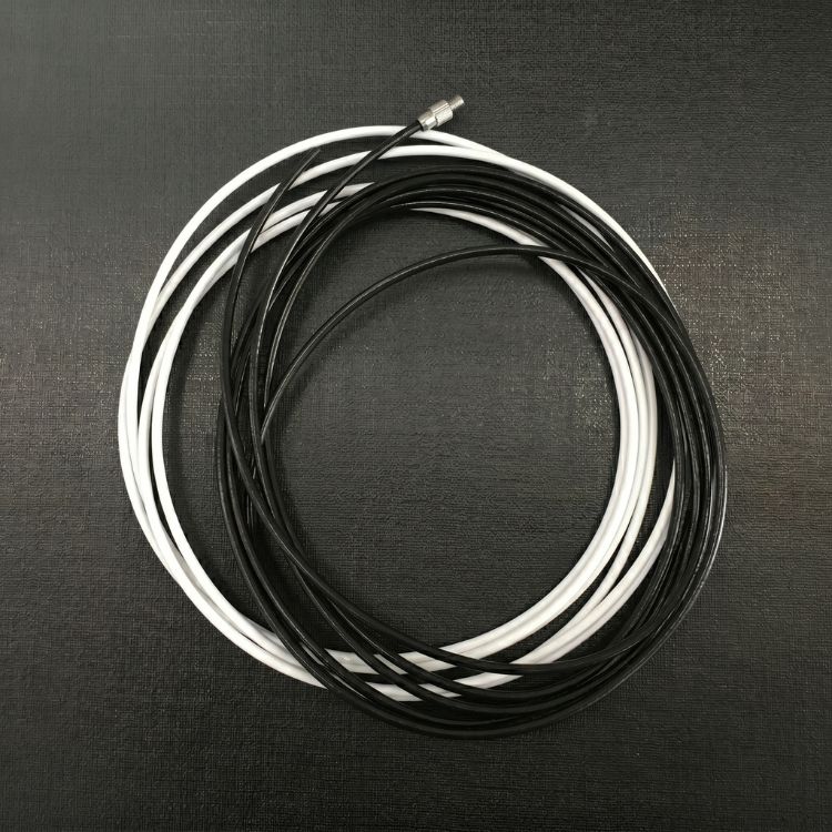 Stainless steel cable side guide used to support outdoor blinds in windy environments.