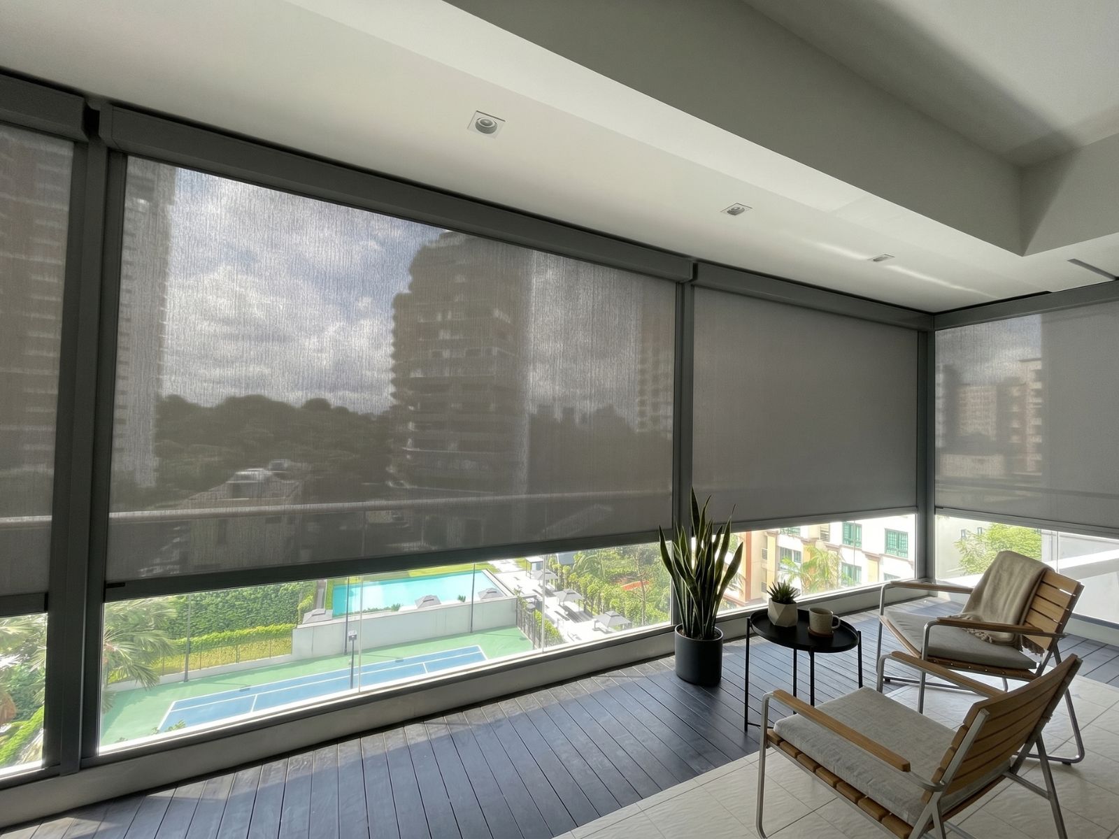 ZipScreen installed on a corner balcony at Parc Clematis condo in Singapore.